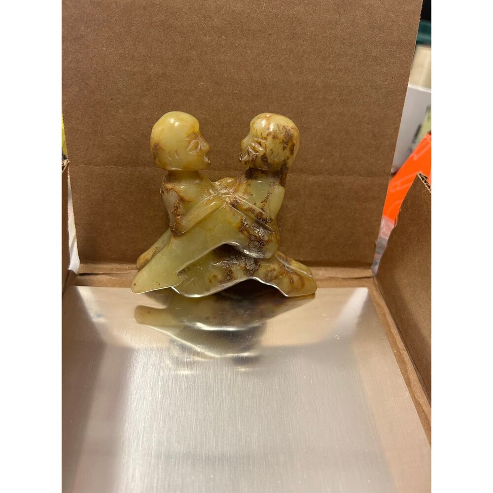 Chinese Hetian jade or nephrite erotic carved figurine. Man and woman embracing